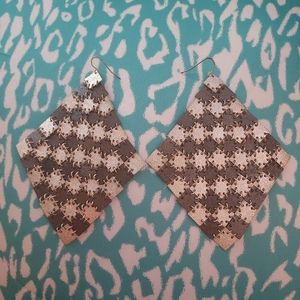 Beautiful long, rhombus shaped silver earrings by Bebe